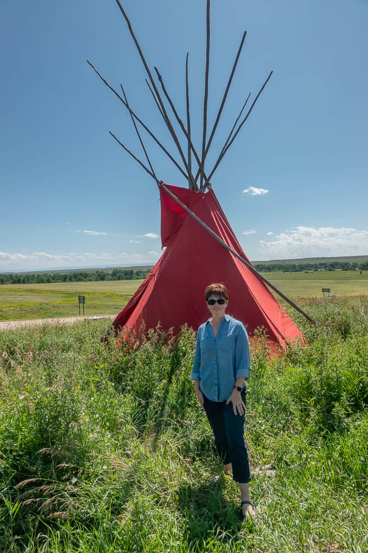 Andi in front of the Teepees in front of the Last Stand Trading Post outside of Little Big Horn in Montana