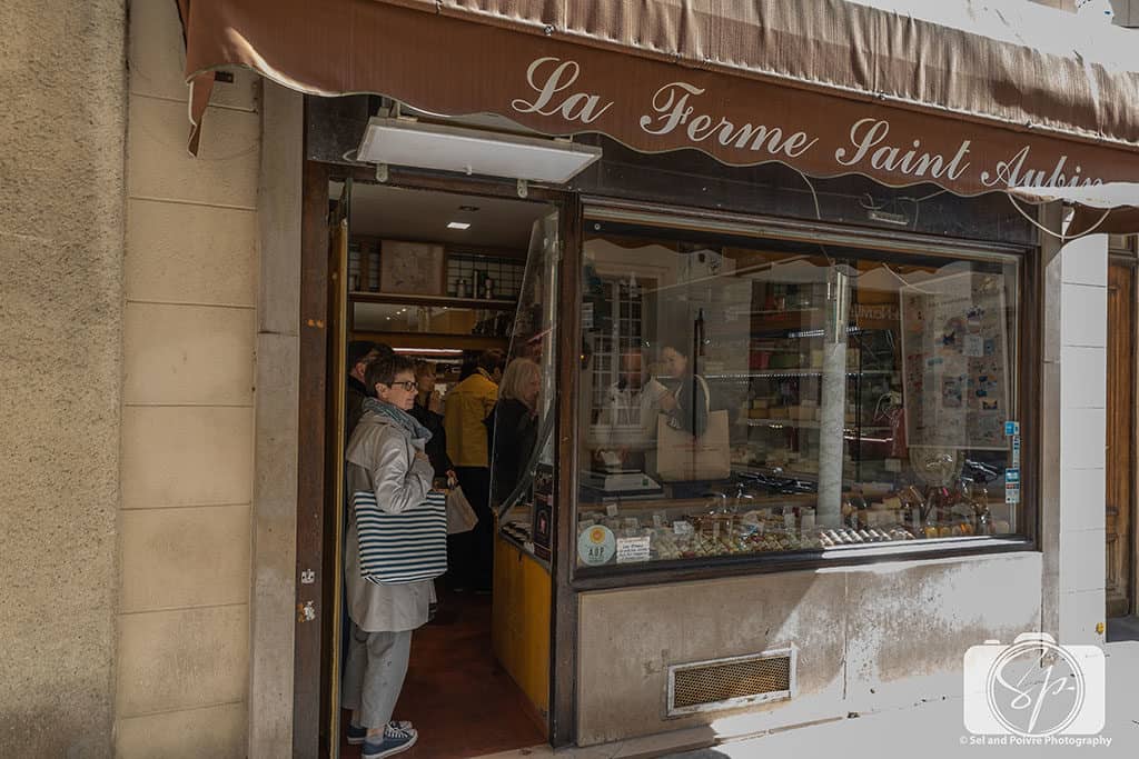 Andi Waiting in line at the Cheese Store in Paris