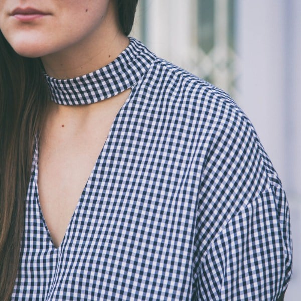 woman in vichy print shirt
