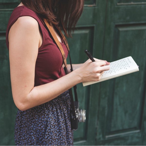 woman taking notes in Paris